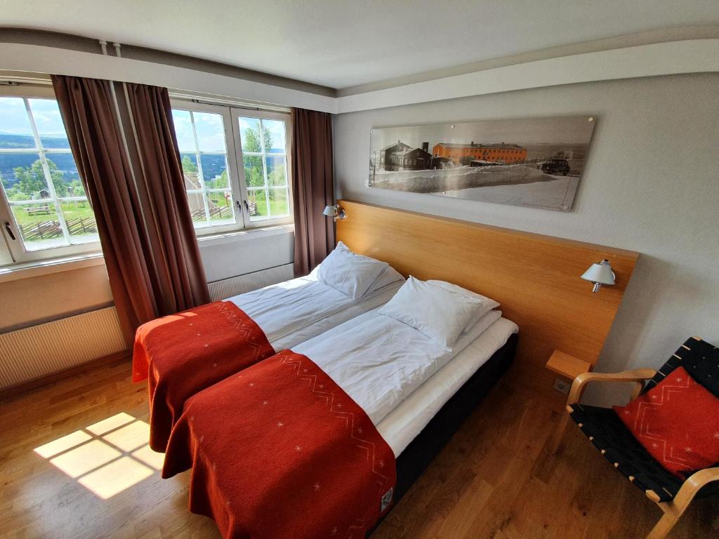 Postel nebo postele na pokoji v ubytování Røros Hotell - Bad & Velvære