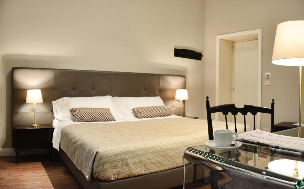 Postel nebo postele na pokoji v ubytování Hotel Touring Wellness & Beauty