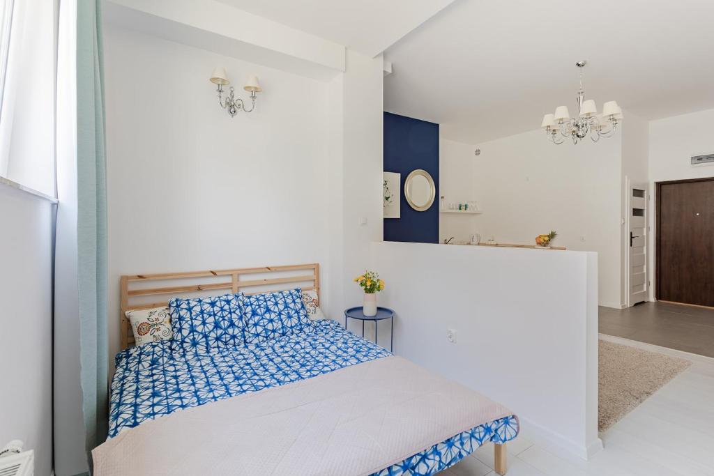 Posteľ alebo postele v izbe v ubytovaní Open Lakes Apartamenty Giżycko