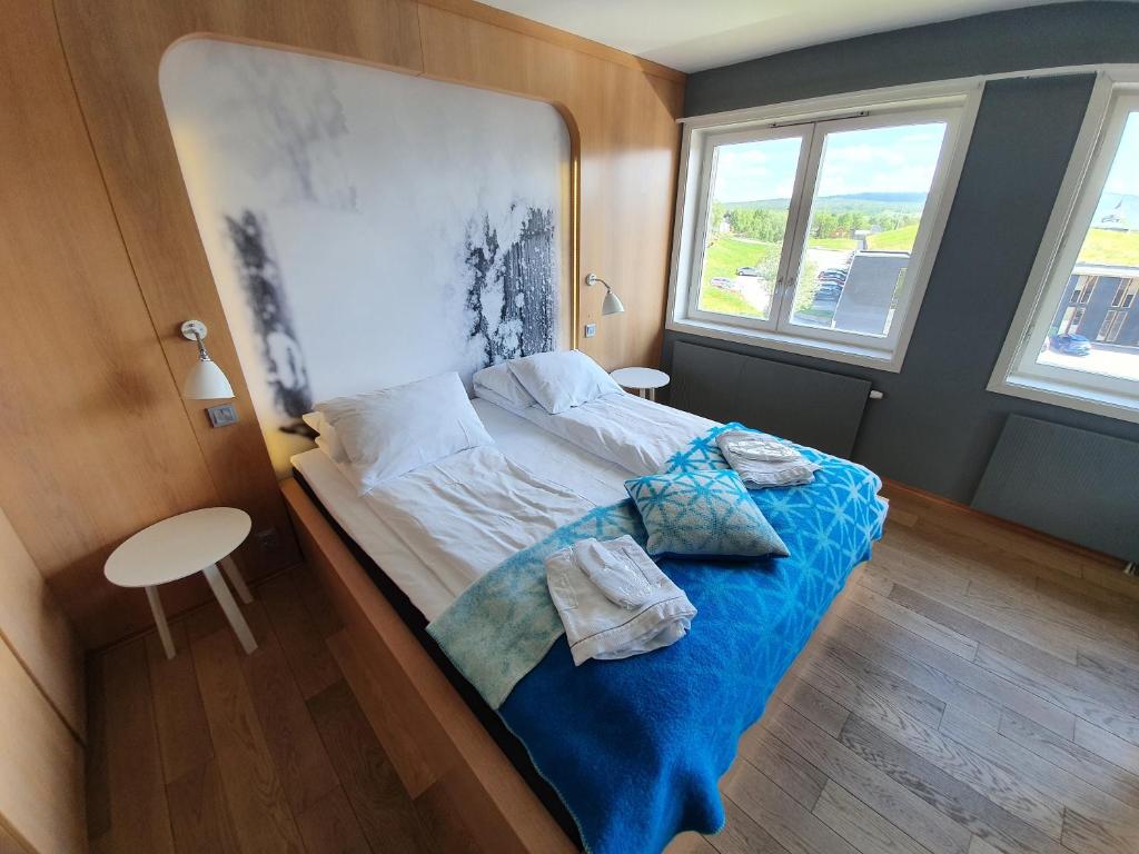 Postel nebo postele na pokoji v ubytování Røros Hotell - Bad & Velvære