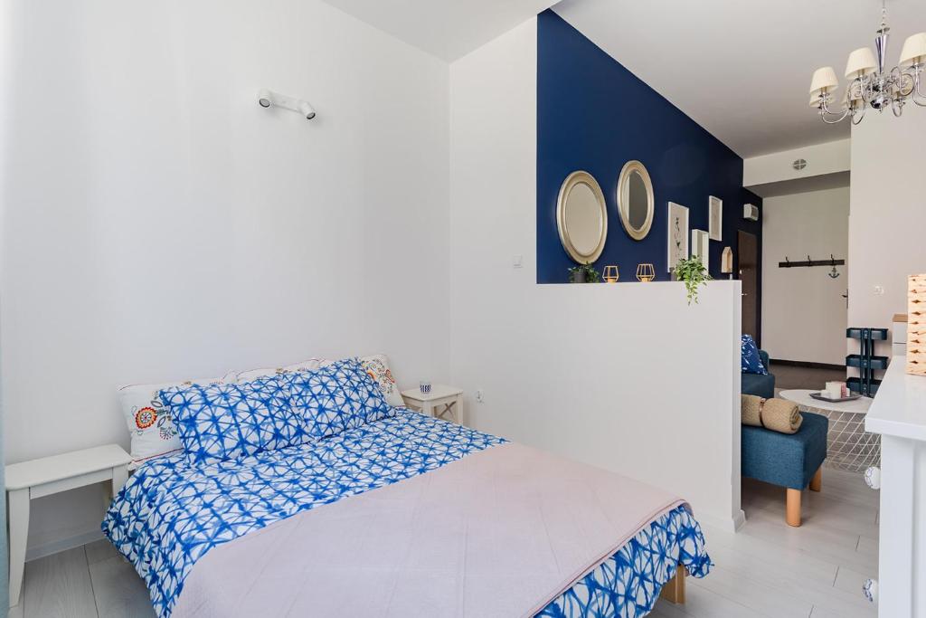 Posteľ alebo postele v izbe v ubytovaní Open Lakes Apartamenty Giżycko
