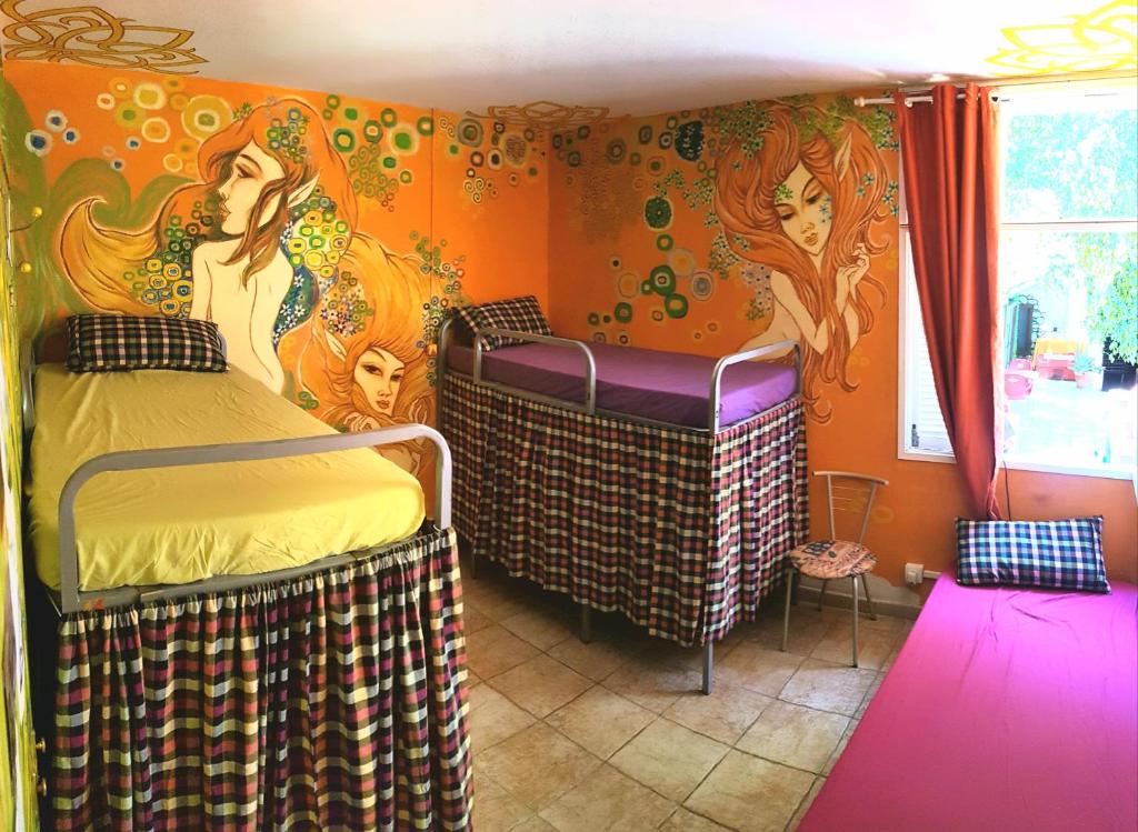 Postel nebo postele na pokoji v ubytování Hostel Los Duendes del Sur