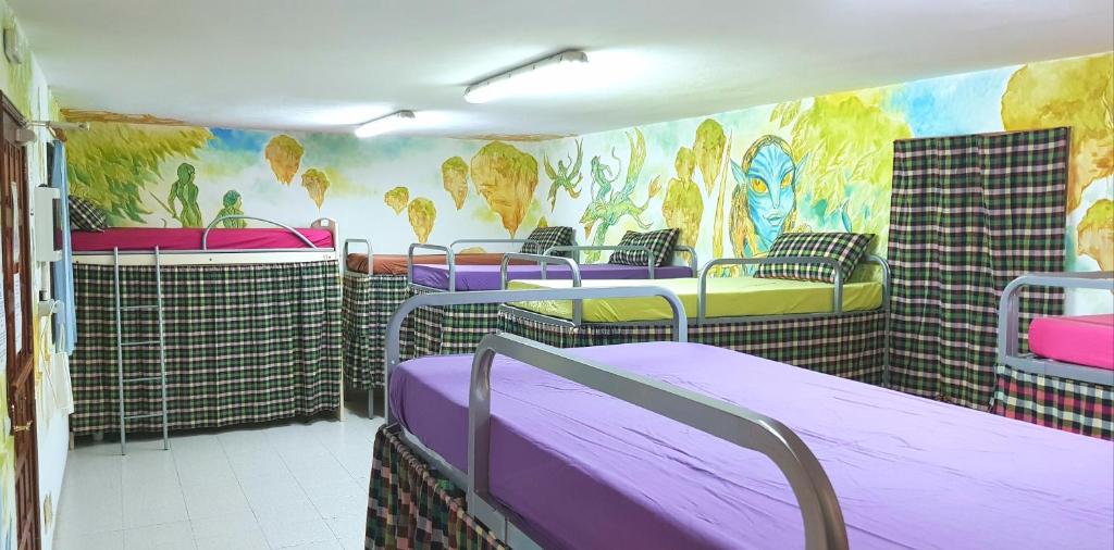 Postel nebo postele na pokoji v ubytování Hostel Los Duendes del Sur