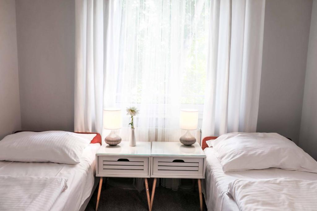 Postel nebo postele na pokoji v ubytování Hotel Portus