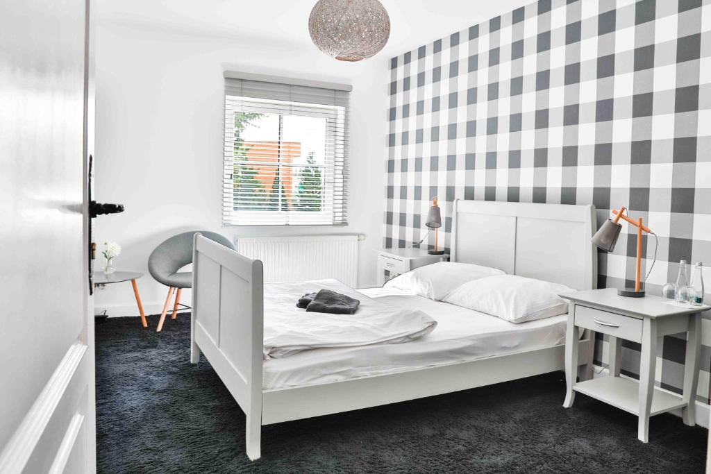 Postel nebo postele na pokoji v ubytování Hotel Portus
