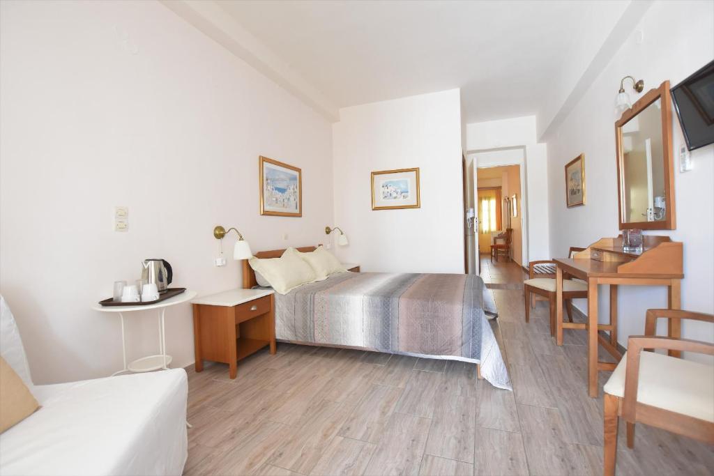 Postel nebo postele na pokoji v ubytování Rodakas Hotel