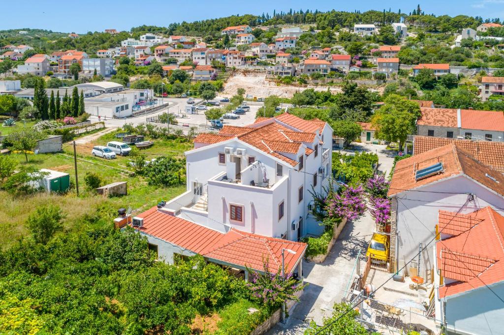 an aerial view of a white house with orange roofs at Villa Dinka in Sutivan