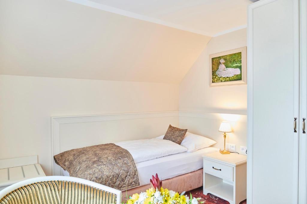 Postel nebo postele na pokoji v ubytování Spa Hotel Centrum