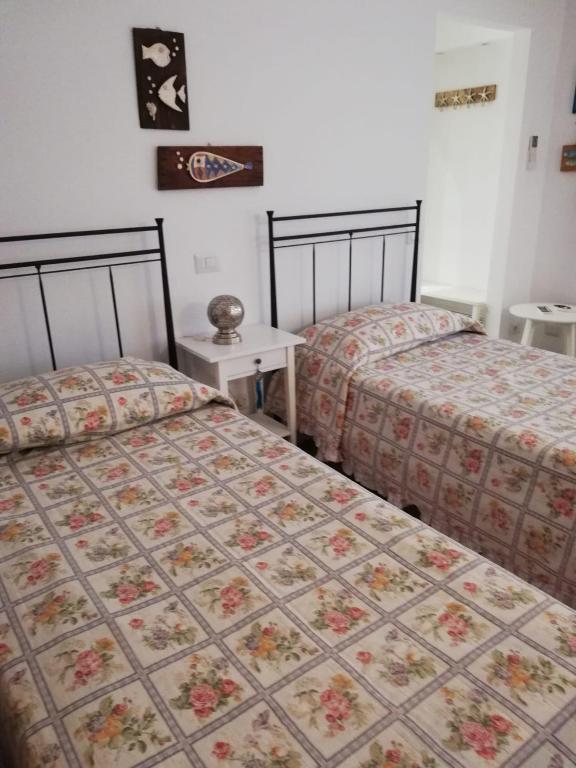 Postel nebo postele na pokoji v ubytování B&B Un mare di Gioia