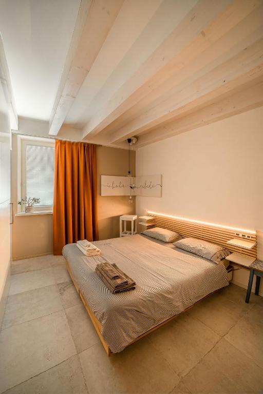Postel nebo postele na pokoji v ubytování Le Scuderie B&B