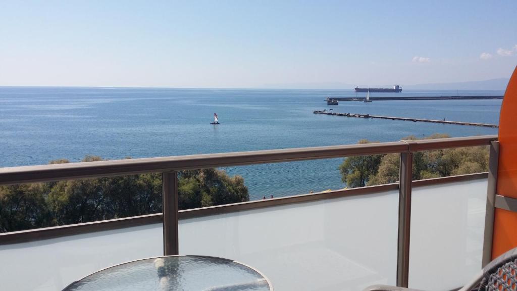a view of the ocean from a balcony at Hotel Flisvos in Kalamata