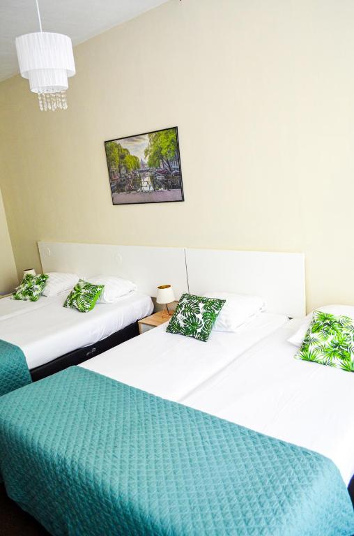Postel nebo postele na pokoji v ubytování Family Hotel Kooyk