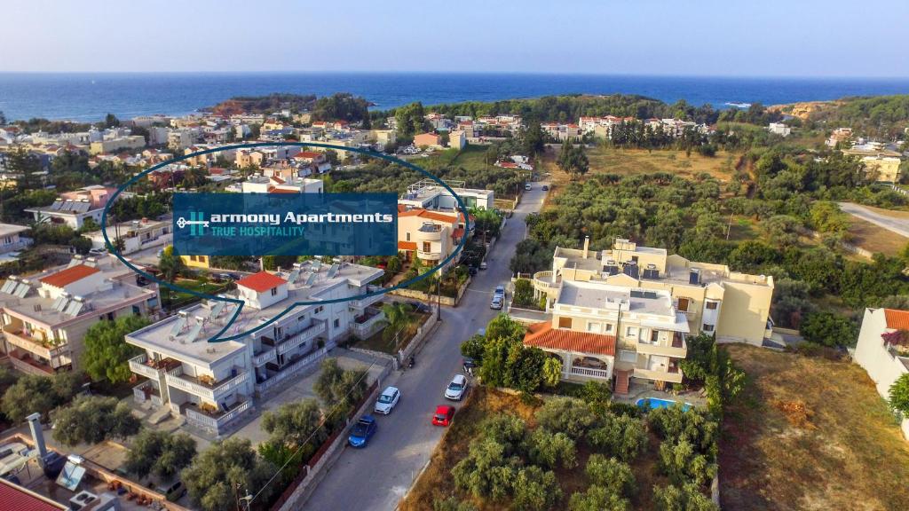 an aerial view of a city with the ocean at Harmony Apartments in Kato Daratso
