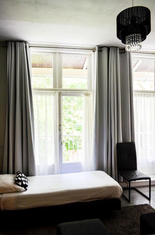 Postel nebo postele na pokoji v ubytování Family Hotel Kooyk