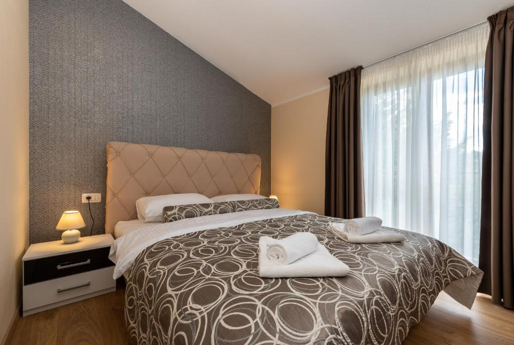 Posteľ alebo postele v izbe v ubytovaní Hotel Tomažići