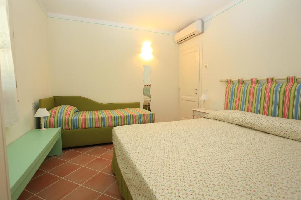 Postel nebo postele na pokoji v ubytování Agriturismo Campallegro