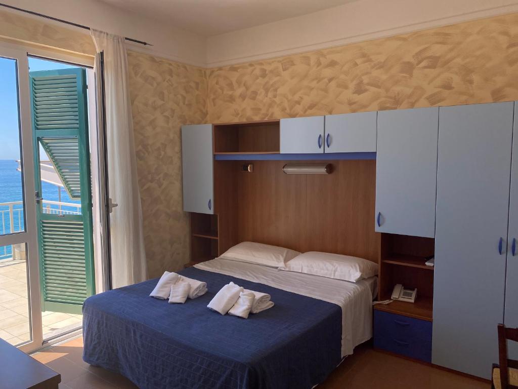 Postel nebo postele na pokoji v ubytování Caravella