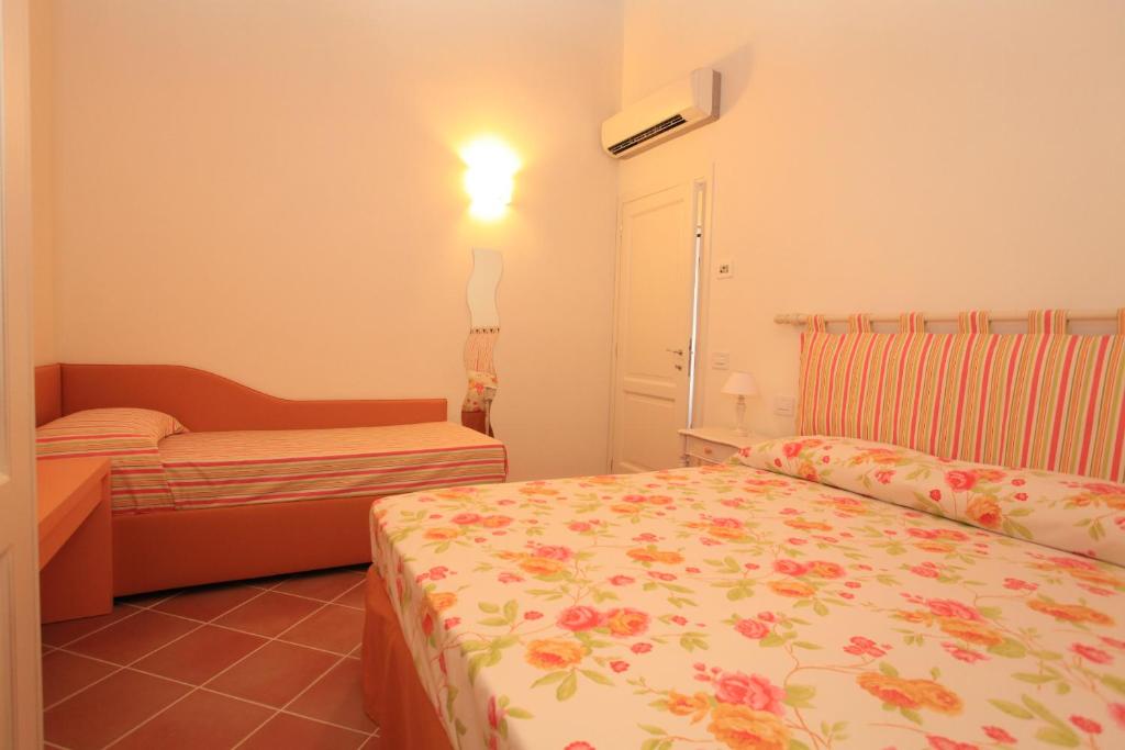 Postel nebo postele na pokoji v ubytování Agriturismo Campallegro