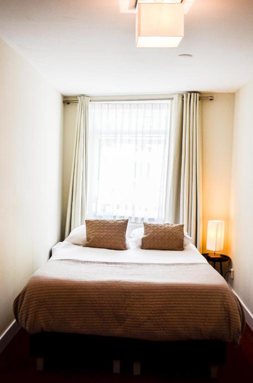 Postel nebo postele na pokoji v ubytování Family Hotel Kooyk