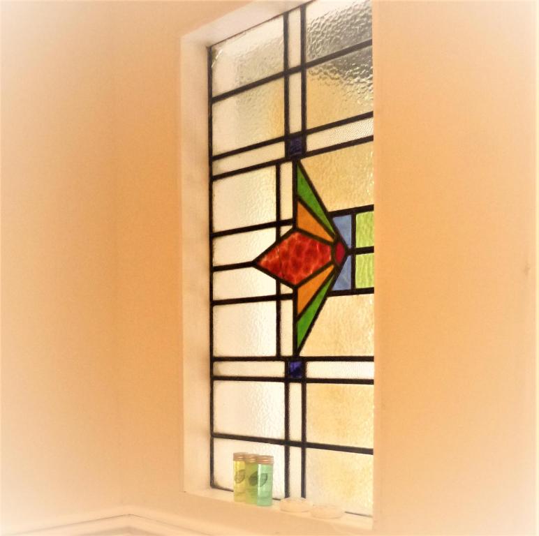 a stained glass window with a star on it at The Burrows Bed and Breakfast in Pembroke