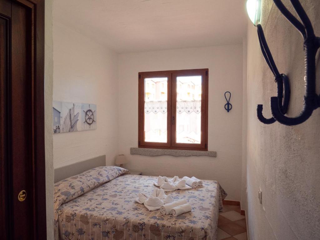 Postel nebo postele na pokoji v ubytování Il Blu Tanca Piras