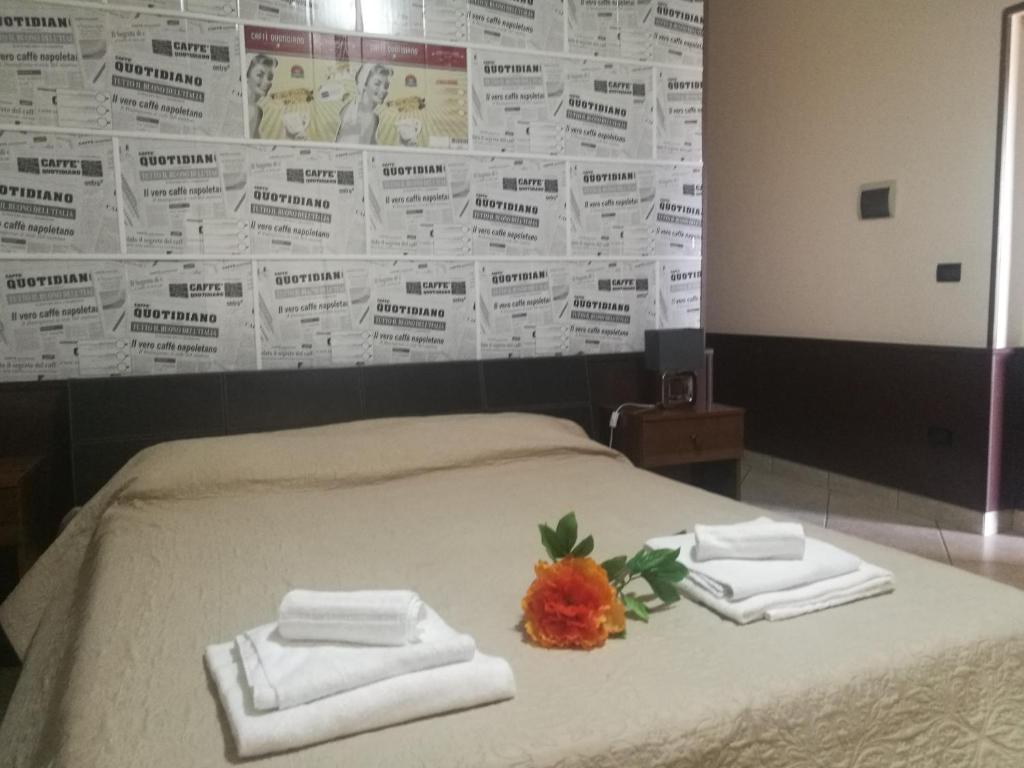 Postel nebo postele na pokoji v ubytování Garden Inn
