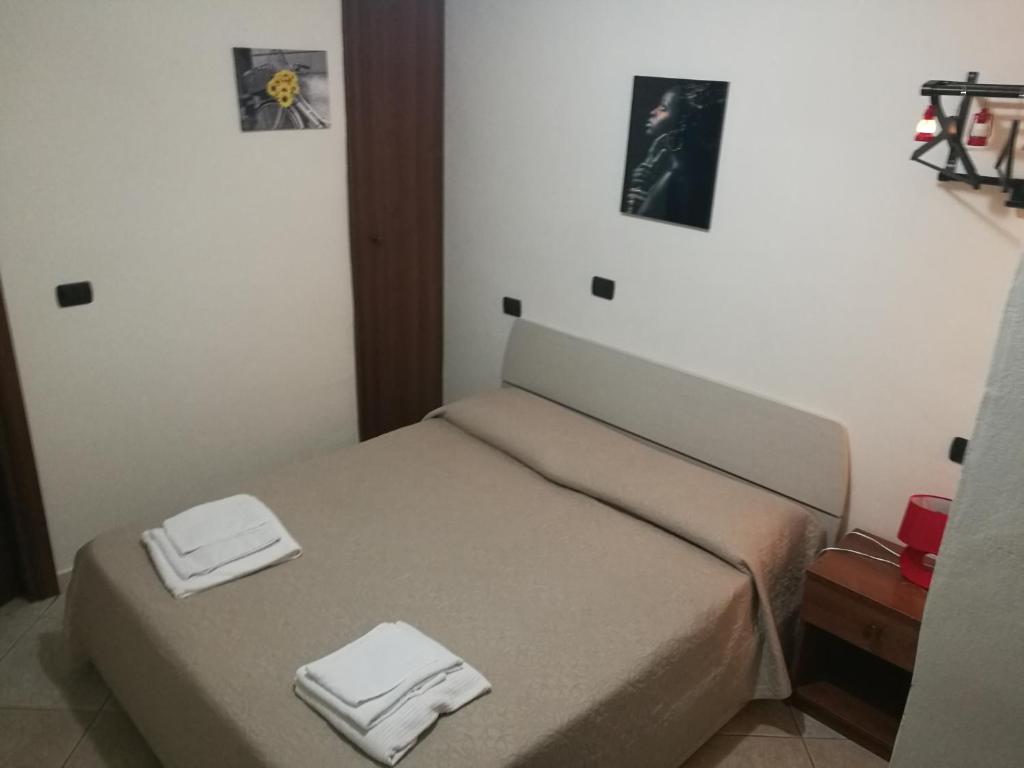 Postel nebo postele na pokoji v ubytování Garden Inn