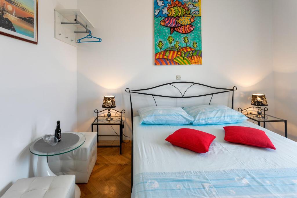 Postel nebo postele na pokoji v ubytování Apartments Jakic