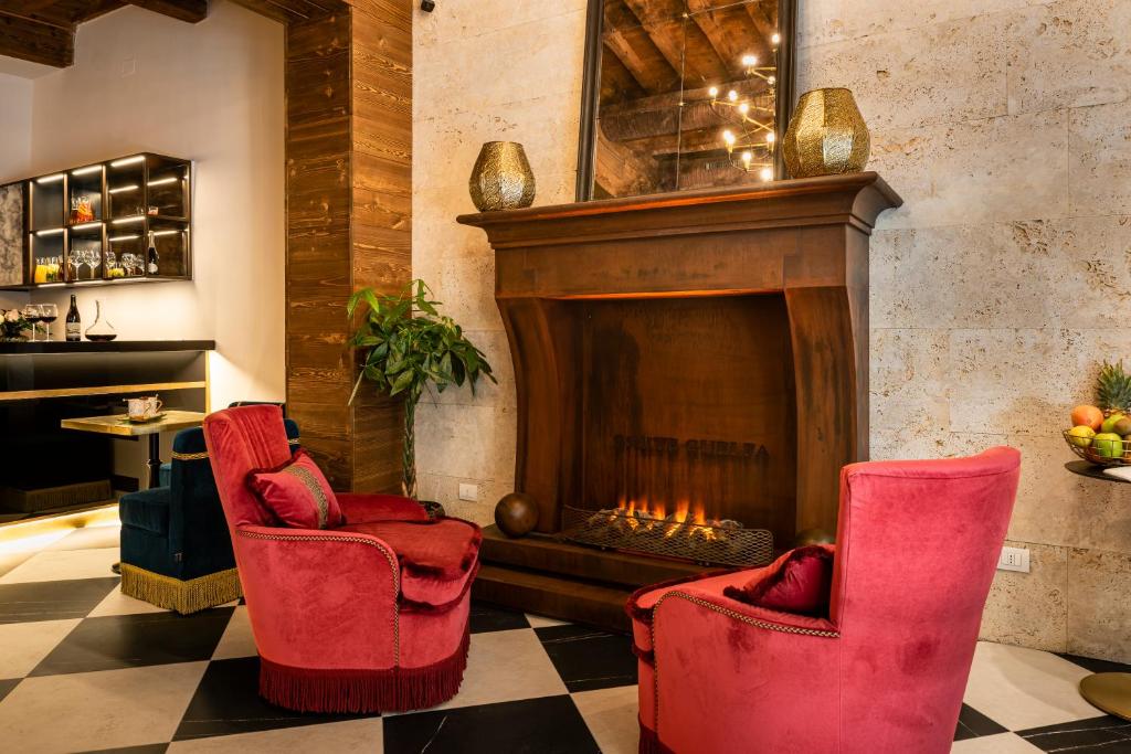 a living room with a fire place and a fireplace at Corte Guelfa in Florence