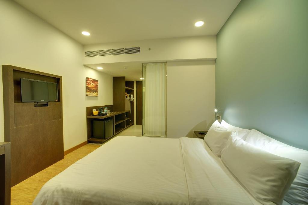 Postel nebo postele na pokoji v ubytování Keys Select by Lemon Tree Hotels, Kochi
