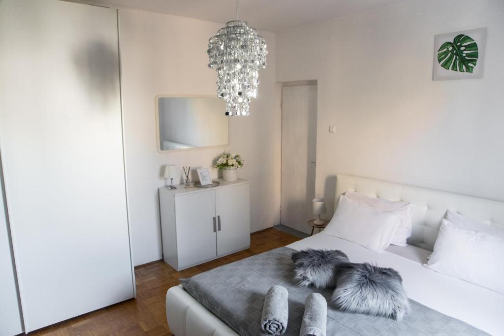 Posteľ alebo postele v izbe v ubytovaní Casa Tosić