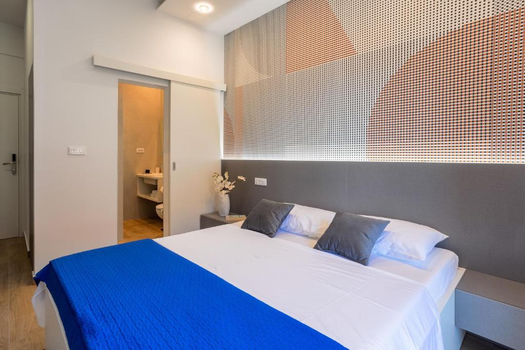 Postel nebo postele na pokoji v ubytování Apartments Jakic 1