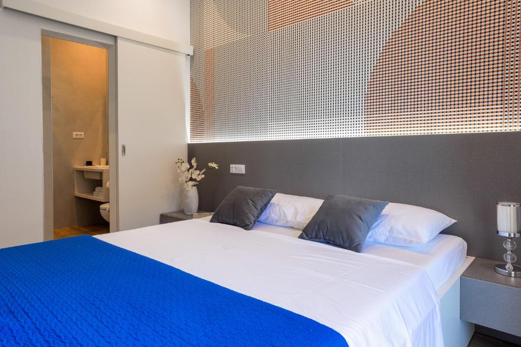 Postel nebo postele na pokoji v ubytování Apartments Jakic 1