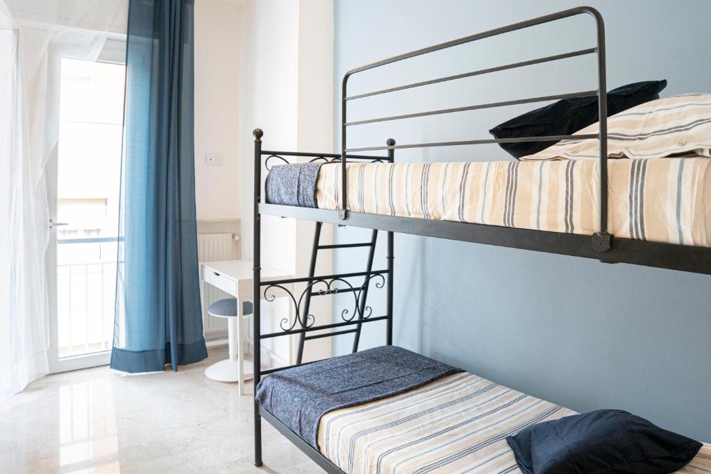 A bed or beds in a room at La casa nel borgo