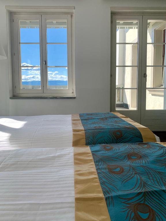 Postel nebo postele na pokoji v ubytování SWISS HOTEL LA COURONNE