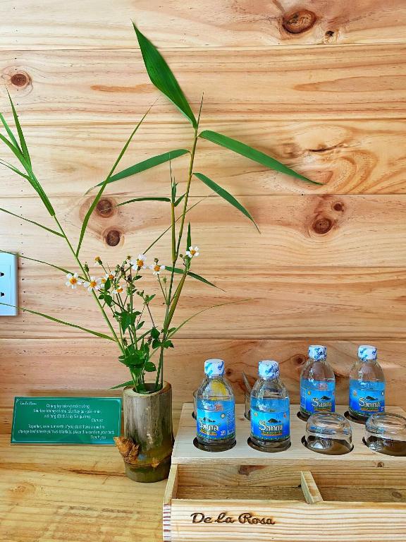 a group of blue bottles of water on a table at Homestay De la Rosa - Côn Đảo in Con Dao