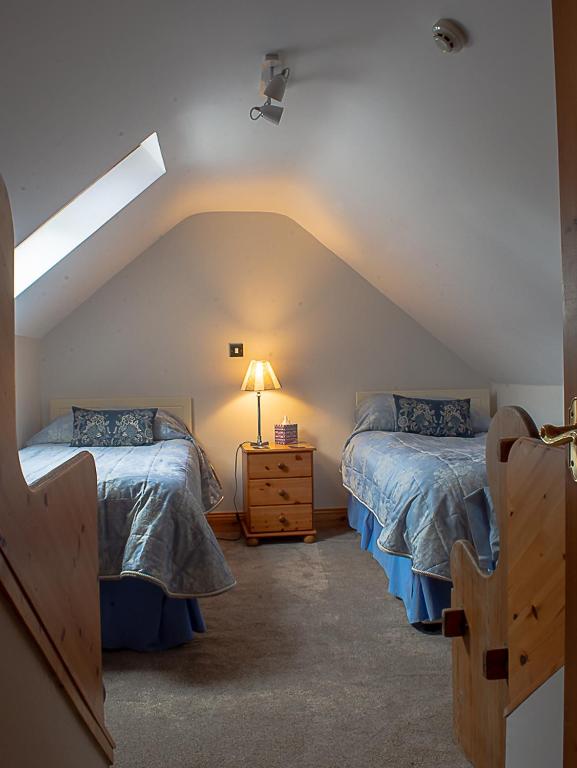 Postel nebo postele na pokoji v ubytování Lis-Ardagh Lodge
