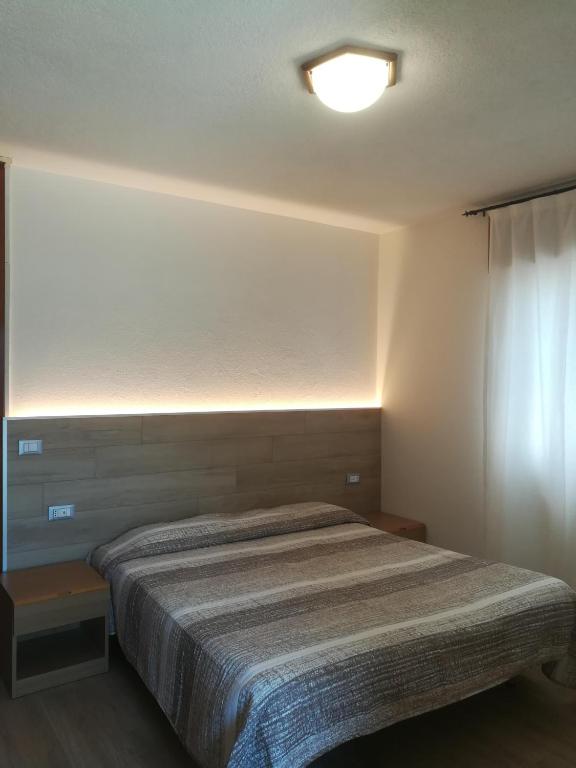 Postel nebo postele na pokoji v ubytování Albergo Ristorante Sargas