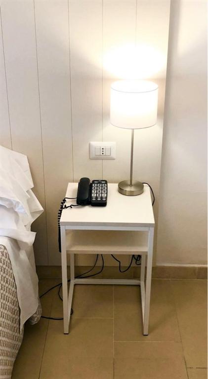 Postel nebo postele na pokoji v ubytování Hotel Villa Eleonora