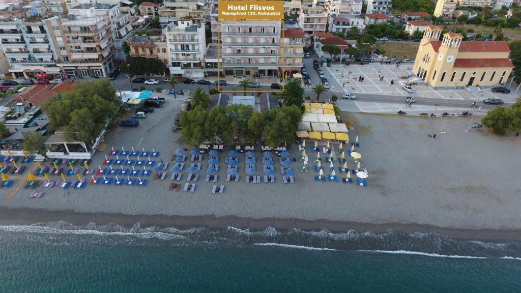 an aerial view of a beach with umbrellas and the water at Hotel Flisvos in Kalamata