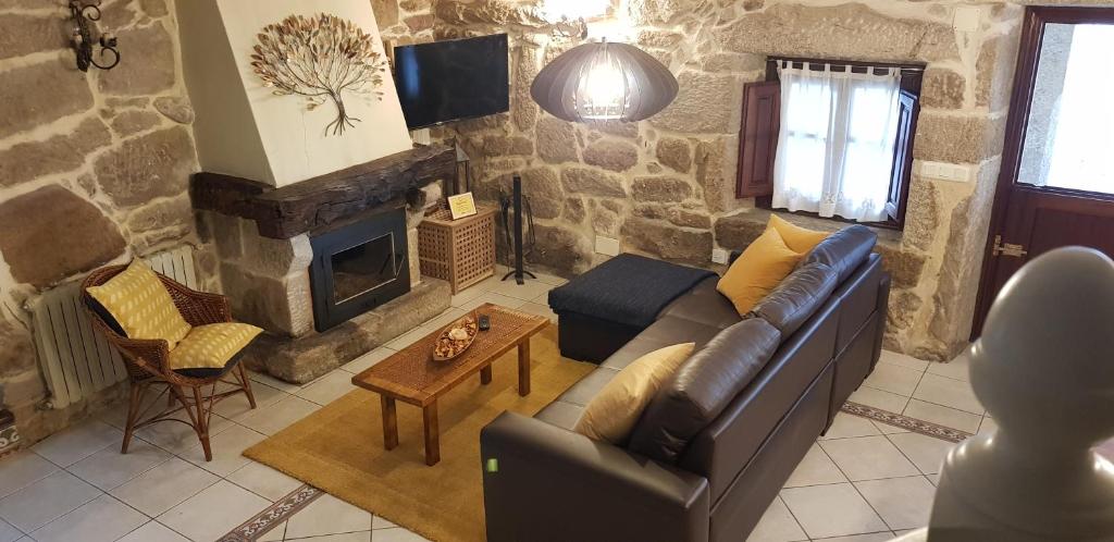 TV a/nebo společenská místnost v ubytování Casa Rualeira