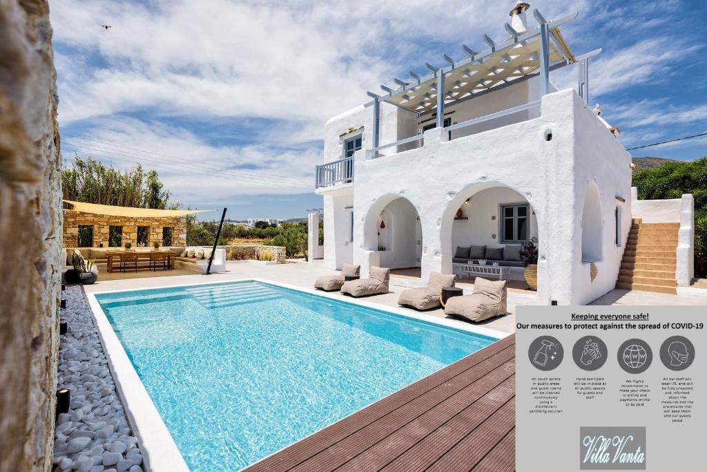 a villa with a swimming pool in front of it at Villa Vanta in Drios