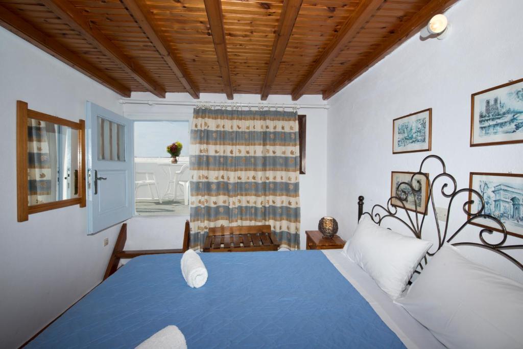 A bed or beds in a room at Sunday Summer House