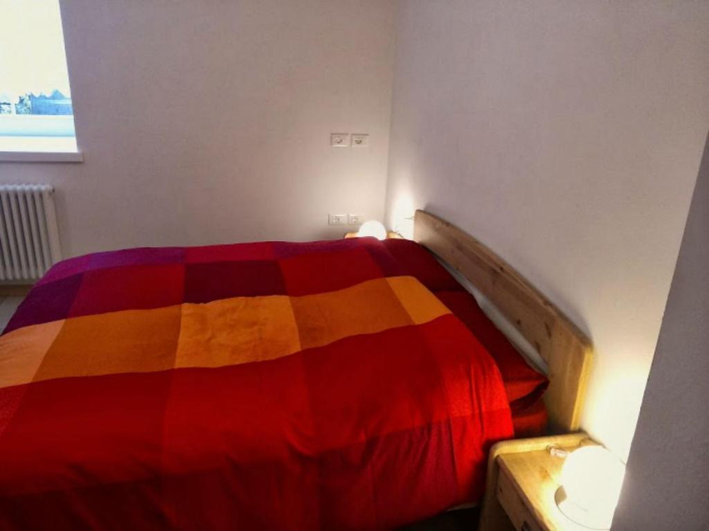 Postel nebo postele na pokoji v ubytování Casa Pergher