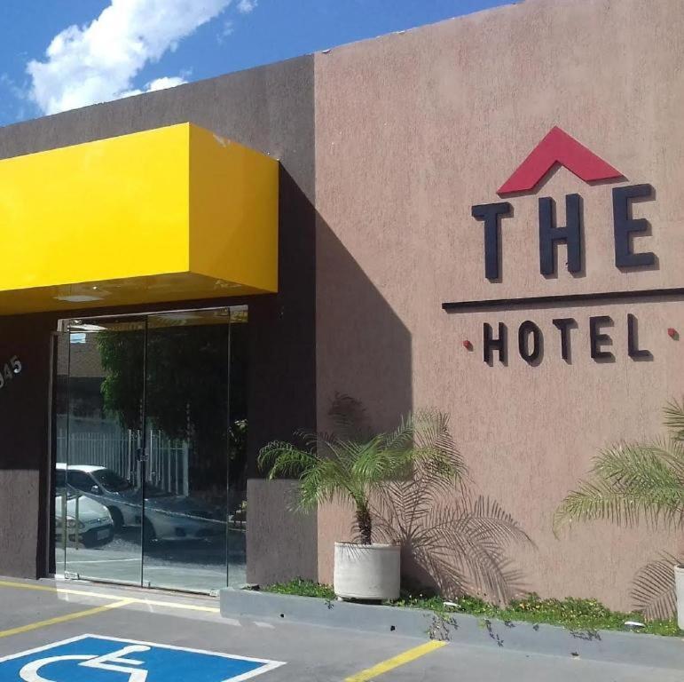 a hotel sign on the side of a building at The Hotel in Teresina