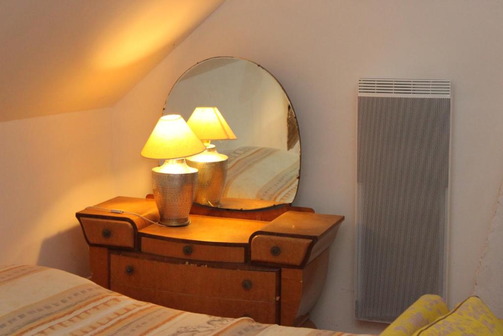 En eller flere senge i et v&aelig;relse p&aring; A la Ferme de la Joie - Chambres d&#39;H&ocirc;tes
