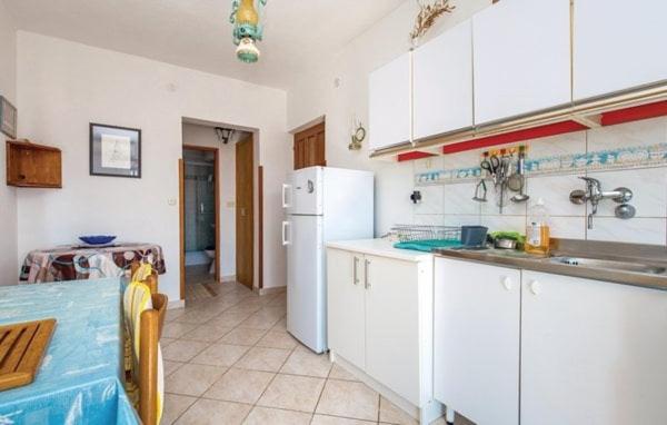 Kuchyň nebo kuchyňský kout v ubytování Apartments Luna
