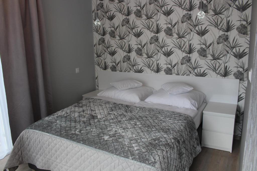 Posteľ alebo postele v izbe v ubytovaní Apartamenty Jagiellońska 23
