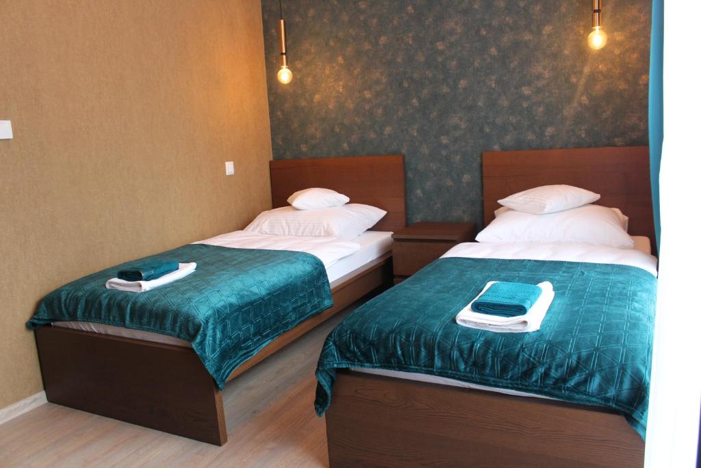 Posteľ alebo postele v izbe v ubytovaní Apartamenty Jagiellońska 23