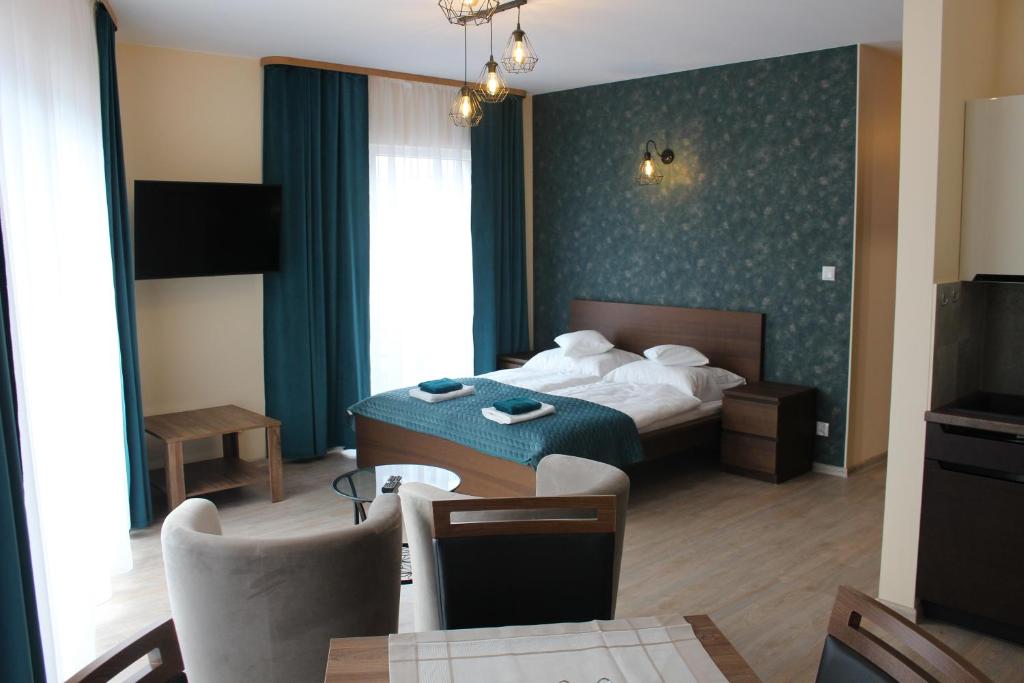 Posteľ alebo postele v izbe v ubytovaní Apartamenty Jagiellońska 23